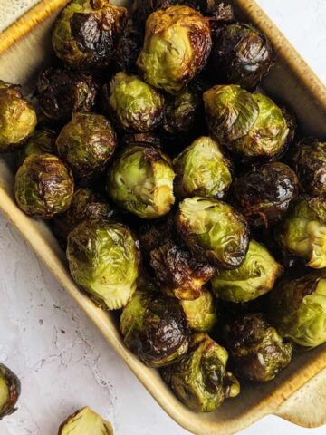 Air fryer Brussels sprouts in a serving dish.